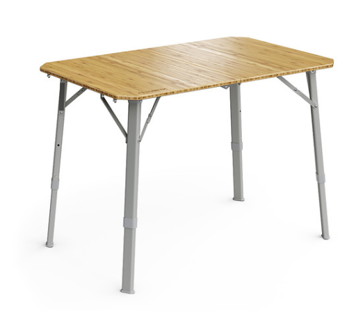 Image of a Dometic folding bamboo camping table with adjustable silver legs, angled front view on a white background.