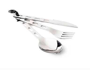 Image of GSI stainless steel 3-piece camping cutlery set including spoon, fork, and serrated knife clipped together, angled front view on white background.