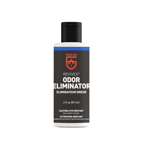 Image of Gear Aid Revivex Odor Eliminator bottle, small white plastic container with black cap and black label, showing product branding and text, front-facing view on white background.