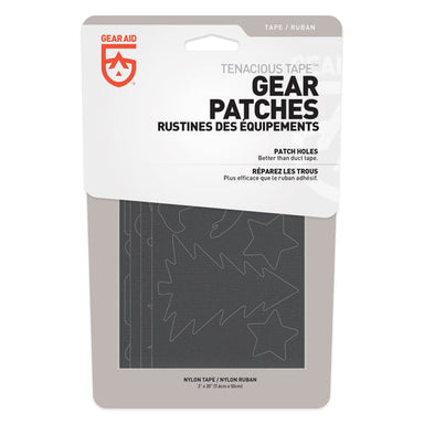 Image of Gear Aid Tenacious Tape Outdoor Gear Patches retail packaging with decorative black patch shapes visible, front-facing product display on white background.