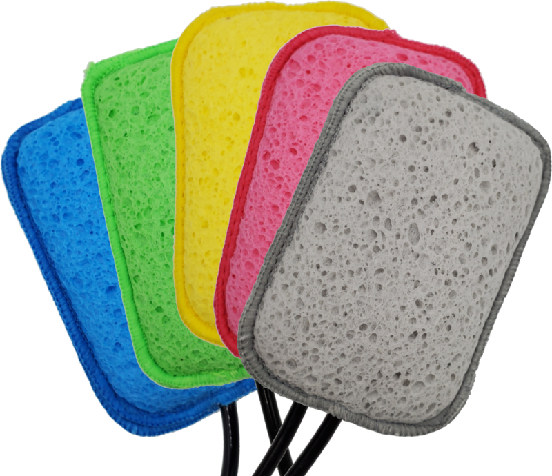 Image of Geyser Systems scrub sponge attachments in blue, green, yellow, pink and grey with porous texture and black hose connections, angled front view on white background.