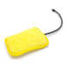 Image of Geyser Systems yellow scrub sponge attachment with porous texture and black hose connection, angled front view on white background.