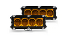 Image of a pair of Heretic 6 Series BA4 Amber Flood LED Pod Lights, featuring a black housing with four amber lenses each and exposed hardware, shown at an angle on a white background.