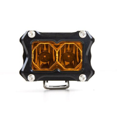 Image of a single rectangular off-road LED light with a black housing, silver bolts, and amber-colored lenses, positioned centrally on a white background.