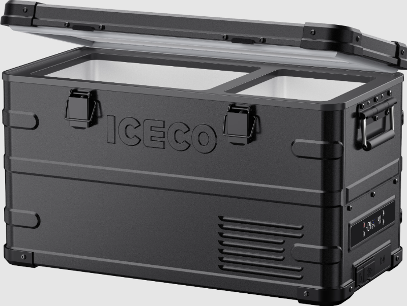 Image of an ICECO portable refrigerator/freezer in a rugged black finish with its lid partially open, revealing a white interior with two distinct compartments, viewed from an angled front perspective on a grey background