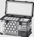 Image of a clear, transparent ICECO portable refrigerator/freezer with its lid open, revealing multiple rows of silver cans neatly stacked inside, showcasing its capacity and organized interior