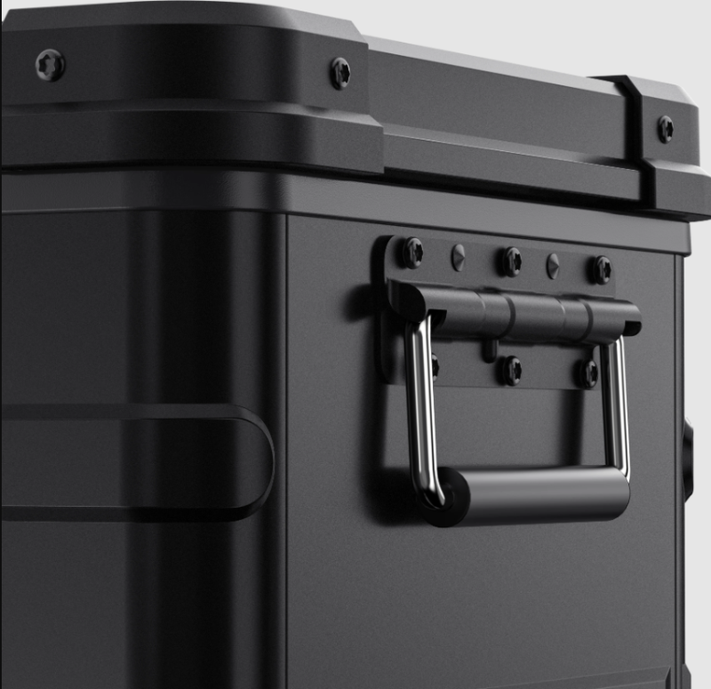 Image of a close-up of a sturdy black handle on an ICECO portable refrigerator/freezer, showing its textured grip and the bolts securing it to the unit, highlighting the durable hardware