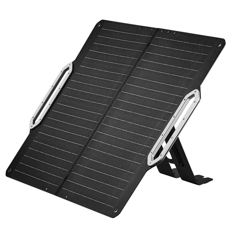 An image of a portable, foldable solar panel, black in color with thin white lines indicating the solar cells, angled upwards as if deployed with its integrated stand. The panel has two light grey, possibly metallic, elongated oval-shaped handles or supports on either side. The background is white
