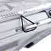 Image of a close-up on the silver latch and bungee cord of an ICECO portable refrigerator/freezer, with a metallic diamond-patterned lid lining visible