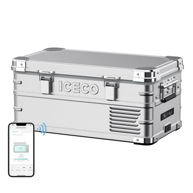 Image of a silver ICECO portable refrigerator/freezer with chrome accents, shown from an angled front and side view, with a smartphone displaying the ICECO app connected wirelessly to the cooler, on a white background