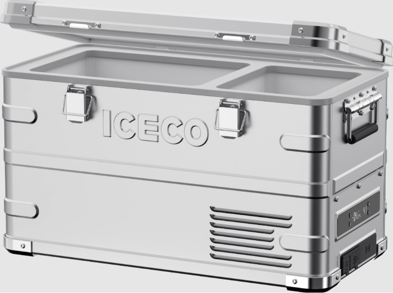 An image of a silver ICECO portable refrigerator/freezer with its lid partially open, revealing two separate compartments inside. The cooler features sturdy latches, side handles, and a control panel with a digital display. The overall design is robust and modern, hinting at its durable construction