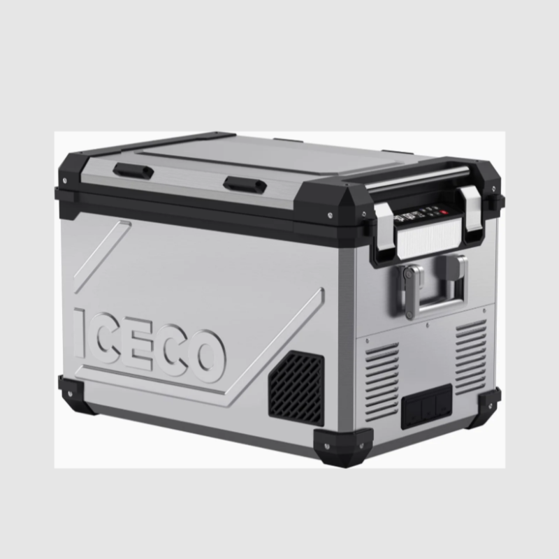 An image of an ICECO portable refrigerator/freezer, silver in color with black accents on the corners and lid. The cooler features a rugged design with textured side panels, a control panel on the right side, and sturdy handles. It is shown from an angled front and side view on a plain light grey background