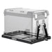 Image of a black ICECO refrigerator slide tray with an outlined, transparent ICECO portable refrigerator placed on top and secured with black straps, shown from an angled front and side view on a white background