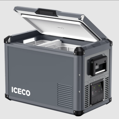 Image of an ICECO portable refrigerator/freezer in dark grey, with the lid partially open revealing the white interior and an internal basket. The side panel shows a control interface with buttons and a screen, alongside ventilation grilles and a black handle. "ICECO" is displayed in white on the front