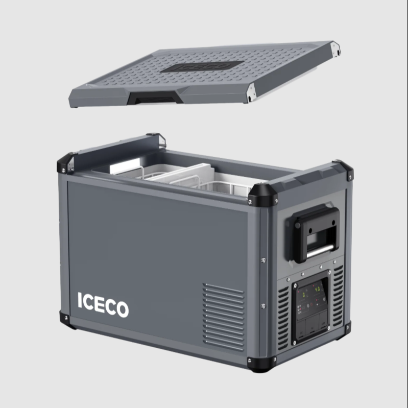 Image of an ICECO portable refrigerator/freezer in dark grey, with its textured lid completely detached and floating above the main unit. The interior of the cooler with a white liner and internal basket is visible. The side panel displays the control interface with a screen and buttons, and a black handle. "ICECO" is written in white on the front