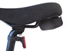 Image of bicycle saddle with attached padded shoulder carry sling and rear reflector, close-up side view on white background.