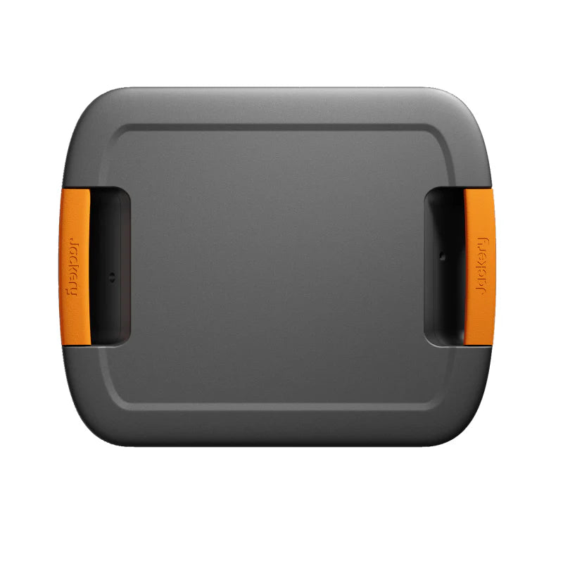 Image of Jackery Battery Pack 5000 Plus expansion battery shown from top view, black and gray casing with integrated orange side handles, flat rectangular design on white background.