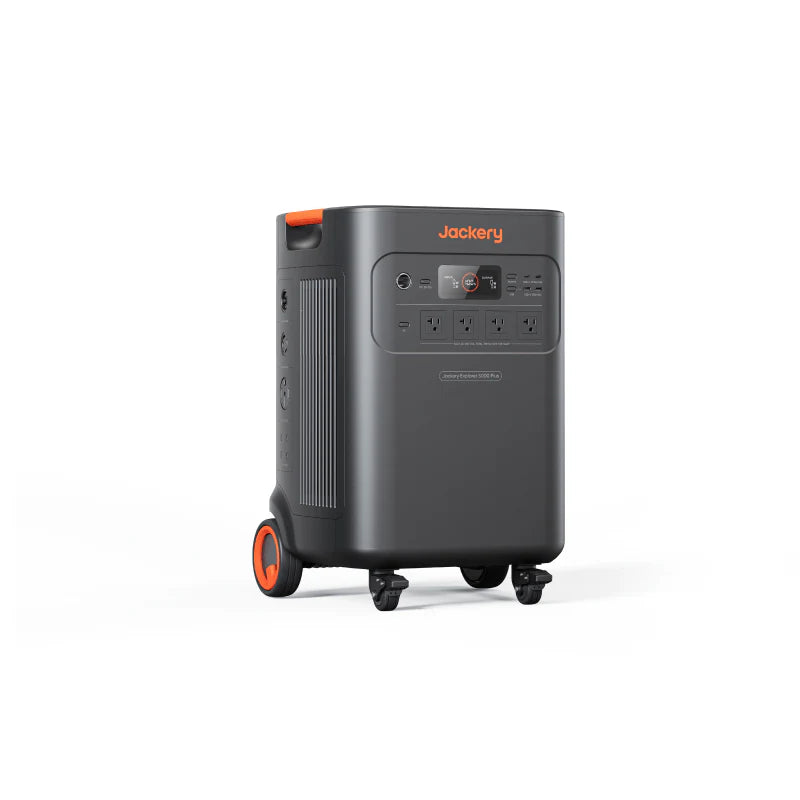 Image of Jackery Explorer 5000 Plus portable power station with built-in wheels and pull handle, black casing with front control panel and multiple outlets, angled front and side view on white background.