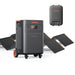 Image of Jackery Explorer 5000 Plus portable power station with wheels paired with foldable solar panels and a smart transfer switch, black and orange design, angled front view on a white background.