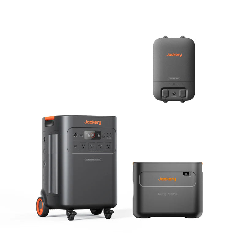 Image of Jackery Explorer 5000 Plus power system showing portable power station on wheels, expansion battery, and smart transfer switch, black design with orange accents, arranged in a clean layout on a white background.