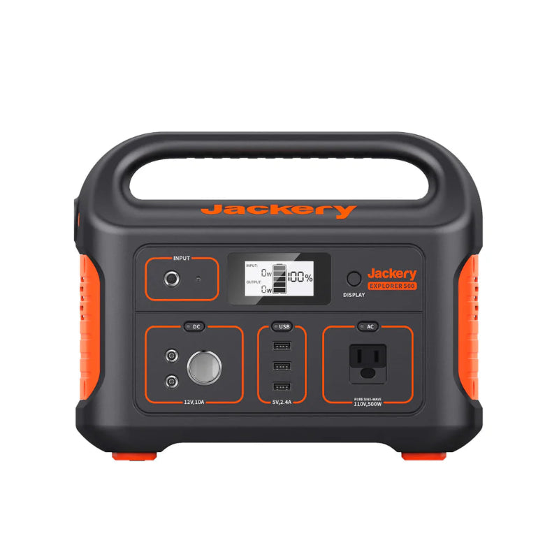 Image of Jackery Explorer 500 portable power station with integrated carry handle, front-facing view showing LCD display, AC outlet, USB and DC ports, black and orange casing on a white background.