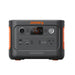 Image of a Jackery Explorer 300 Plus portable power station, compact black and gray body with orange accents and front control panel, straight-on front view on white background.