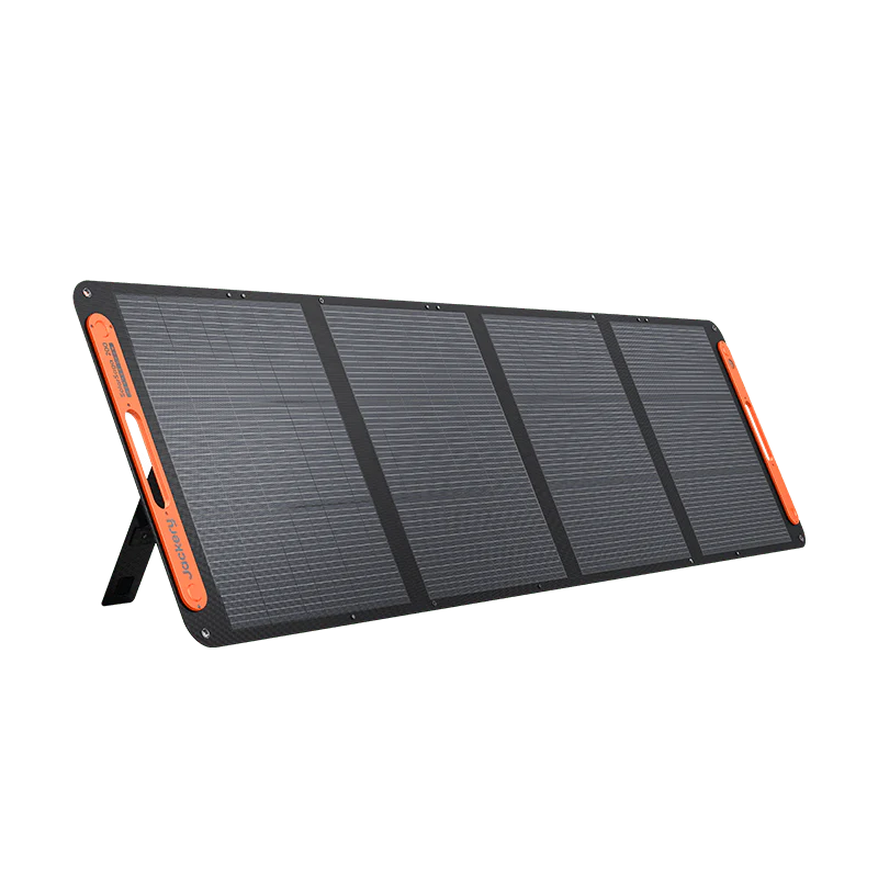 Image of a Jackery portable foldable solar panel with black photovoltaic cells and orange accents, partially deployed on built-in kickstands, angled front and side view on white background.