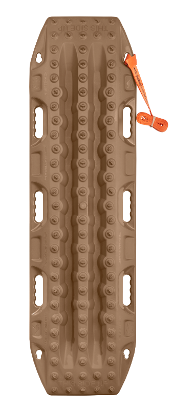 Image of a tan off-road recovery board with an orange tether, laid flat to display its full traction pattern and features on a light grey background.
