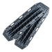 Image of gray off-road recovery traction boards with raised cleats and integrated handles, stacked in an angled front view on black background.
