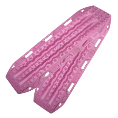 Image of pink off-road recovery traction boards with raised cleats and built-in handles, stacked in an angled front and side view on black background.