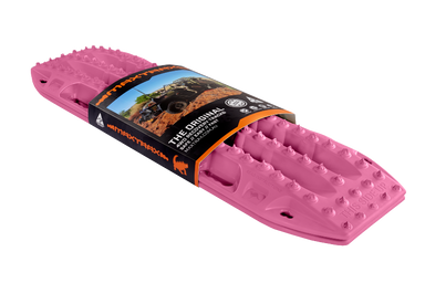 Image of pink MAXTRAX MKII recovery traction boards with retail sleeve packaging, angled front and side view on black background.