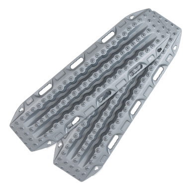 Image of two light gray traction recovery boards with a textured, studded surface and integrated handles, designed for off-road vehicle recovery. The boards are shown angled against a white background.
