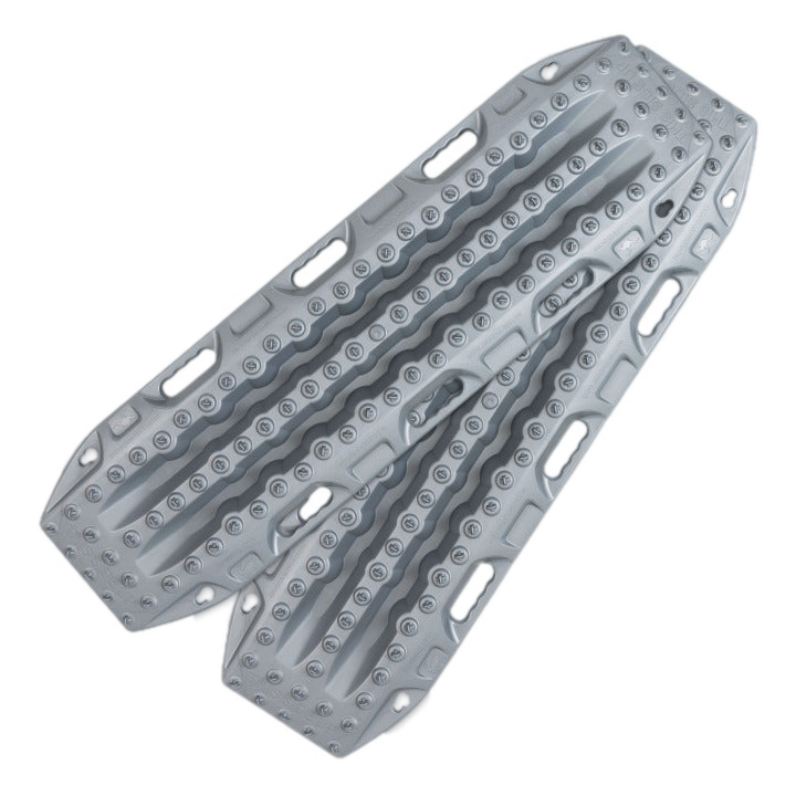 Image of two light gray traction recovery boards with a textured, studded surface and integrated handles, designed for off-road vehicle recovery. The boards are shown angled against a white background.