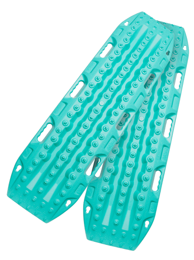 Image of teal off-road recovery traction boards with raised cleats and built-in handles, stacked in an angled front and side view on black background.