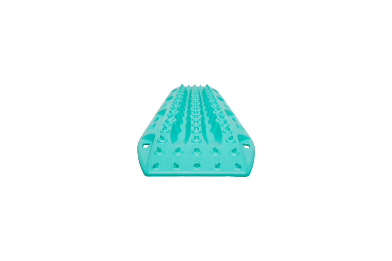Image of teal MAXTRAX MKII recovery traction board with raised cleats, low front profile view on black background.
