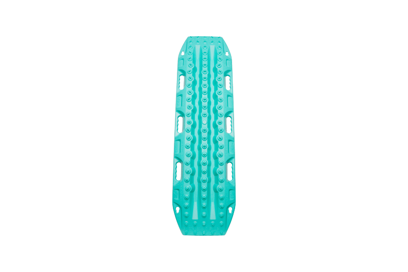 Image of teal MAXTRAX MKII recovery traction board with raised cleats and integrated carry handles, top-down view on black background.