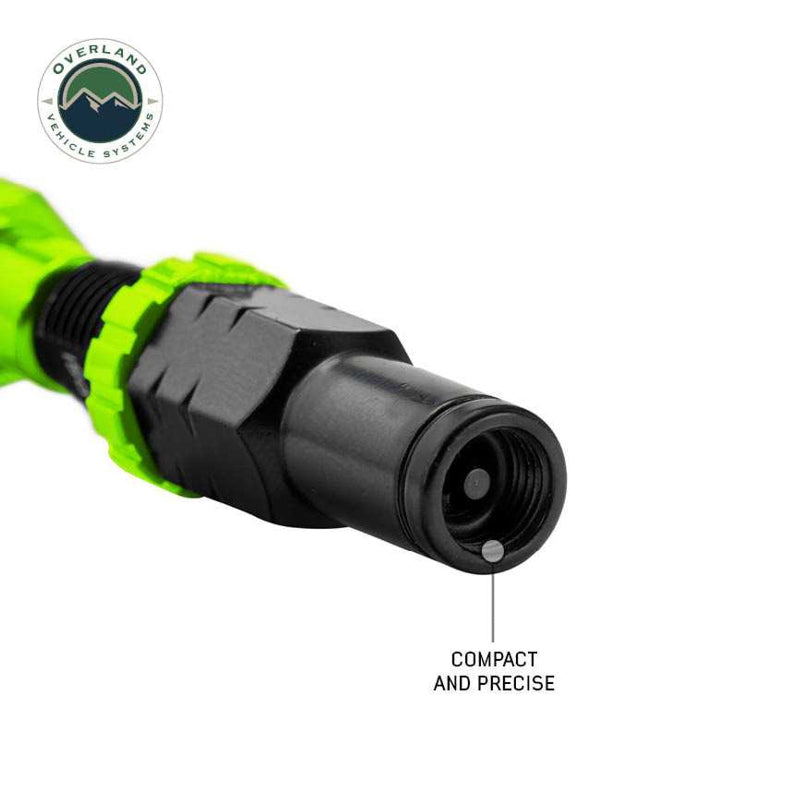 Image of the end of an Up Down Air tire deflator, highlighting its compact and precise design with a green ring and black tip, on a white background with the "Overland Vehicle Systems" logo.