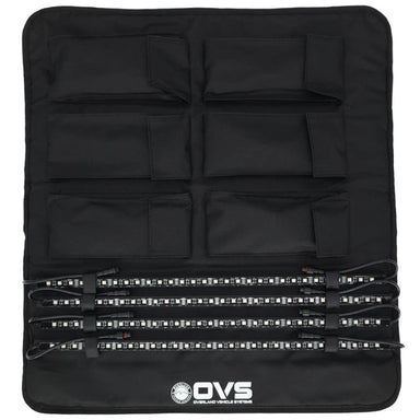 Image of OVS 4-piece universal LED light kit organized in a black roll-up storage panel with multiple pockets and secured LED light bars, top-down view on a white background.