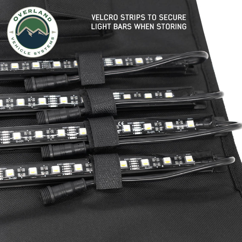 Image of OVS universal LED light bars secured with Velcro straps inside a black roll-up storage panel, close-up view showing organized cable and light storage on a white background.