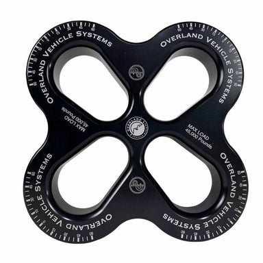 Image of OVS 4-Way R.D.L. 8-inch recovery distribution link in black aluminum finish, four symmetrical load points with engraved markings, top-down view on white background.