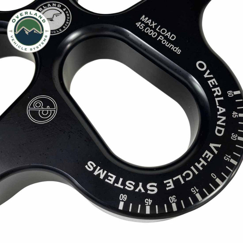Image of OVS 4-Way R.D.L. 8-inch recovery distribution link close-up showing 45,000 lb max load markings and black aluminum finish, angled detail view on white background.