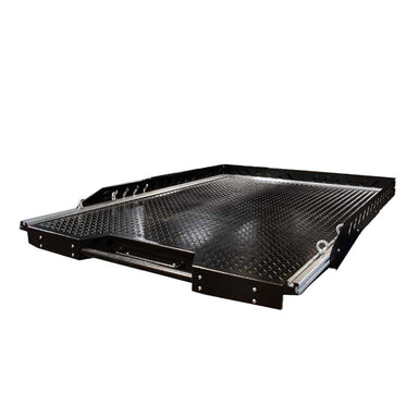 Image of Overland Vehicle Systems truck bed extension with a diamond plate surface and pull-out handle, angled front view on a white background