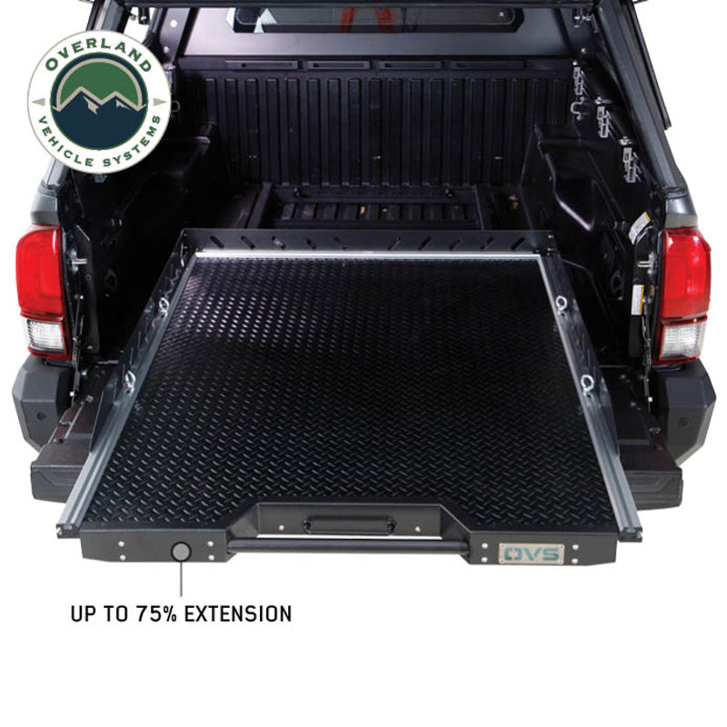 Image of Overland Vehicle Systems truck bed extension with a diamond plate surface, showing up to 75% extension, side view with visible ergonomic handle and truck bed interior