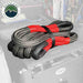 Image of Overland Vehicle Systems kinetic recovery rope with red reinforced loops and black braided synthetic rope, neatly coiled and stored inside a vehicle drawer system, angled top view.