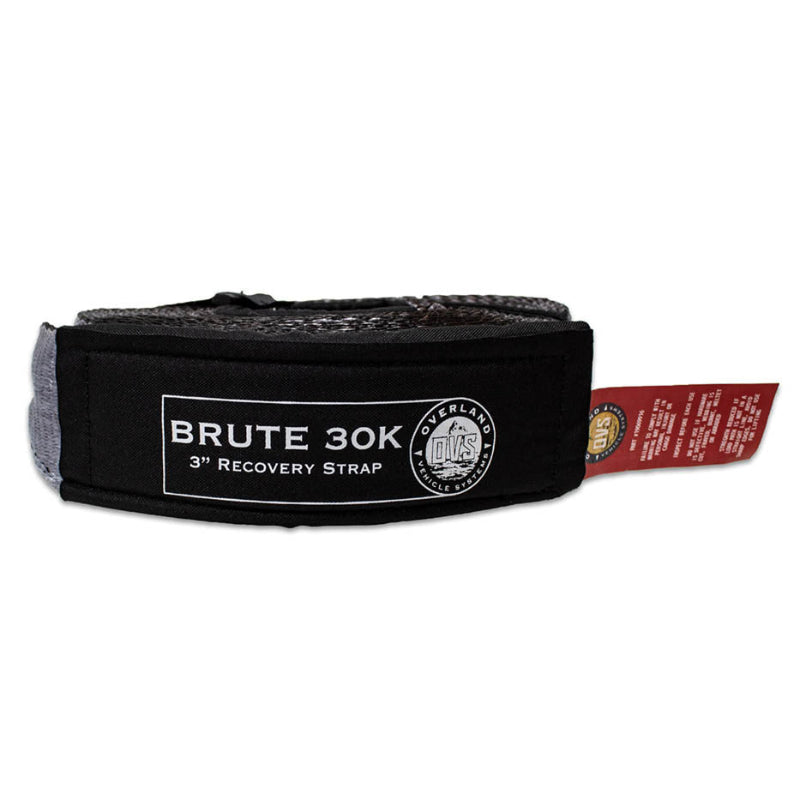 Image of OVS Brute 30K recovery tow strap rolled and secured, black padded protective sleeve with gray synthetic strap and branded label, side view on white background.