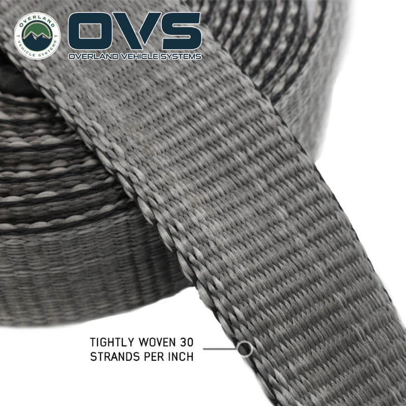 Image of OVS Brute Recovery Tow Strap close-up showing tightly woven synthetic fibers with 30 strands per inch, gray textured webbing detail on a white background.