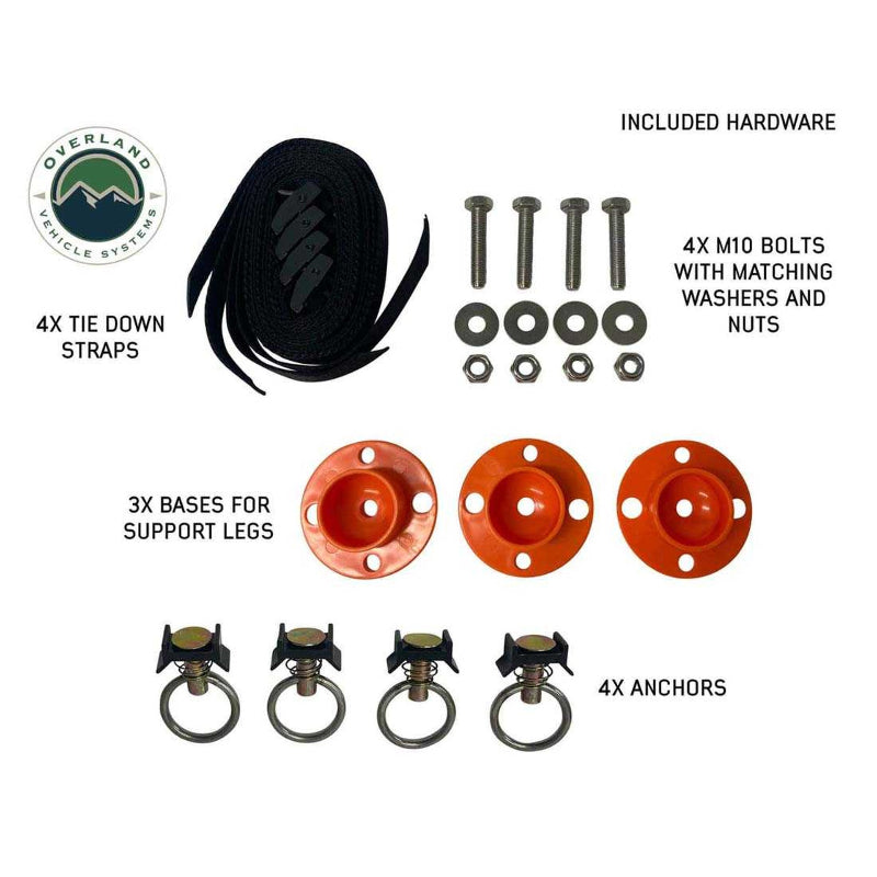 Image displaying the hardware included with the camp kitchen cargo box, laid out on a white background. The hardware includes four tie-down straps, three orange bases for support legs, four anchors, and four M10 bolts with washers and nuts