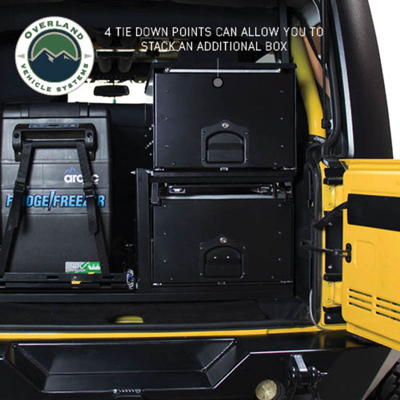 Overland Vehicle Systems (OVS) Cargo Box 210102017 with two stacked cargo boxes, showing the secure tie-down points for stacking an additional box. An ARB fridge freezer is also visible on the left side, showcasing the storage options in a vehicle's cargo area