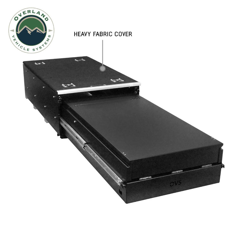 Image of a black Overland Vehicle Systems (OVS) Cargo Box with a single drawer partially extended, showing the "HEAVY FABRIC COVER" on top and a close-up angled view on a white background