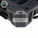 Image of dark gray overland dry storage box corner featuring built-in stainless steel bottle opener, close-up angled side view on white background.